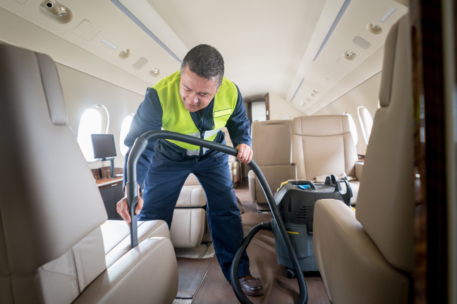 Man cleaning an airplane